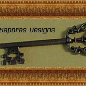 Antique Bronze In Color Skeleton Key Design Charm